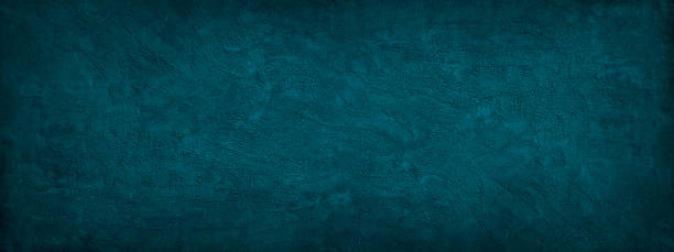 istock Dark blue green abstract background. Dark teal grunge background. Wide banner. 1283843211