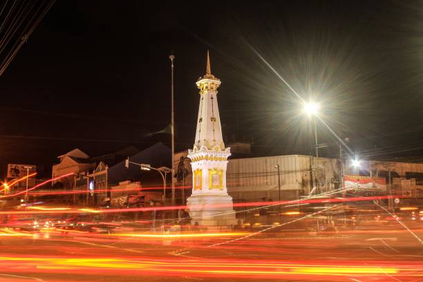 Tugu Jogja with Slow Shutter Tugu Jogja with slow shutter long exposure at night and fire light trail effect. This picture taken in Yogyakarya Indonesia. Tugu Jogja is a icon of Yogyakarya City. yogyakarta stock pictures, royalty-free photos & images