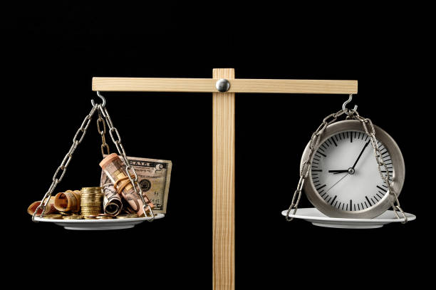 istock Clock and Currency Time is Money Concept 1283844230