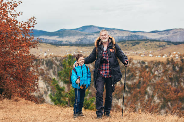 istock Father with son hiking in nature 1283844464