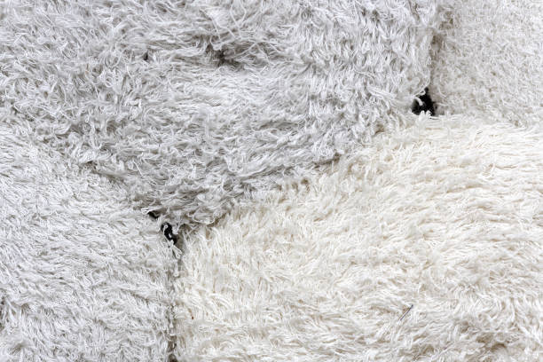 istock Rolls of factory textiles close-up. Raw material or material for making rags. 1283844511