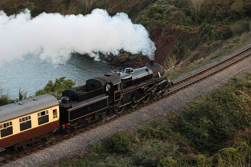 Detail of red wheels of a vintage steam train locomotive