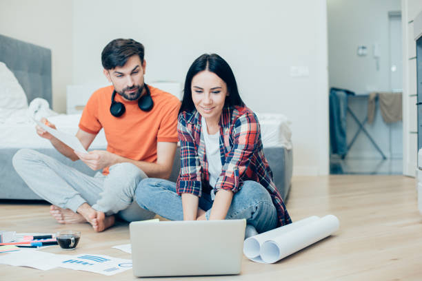 istock Young couple of designers working on their new project 1283845639