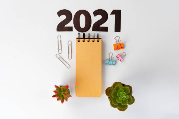 istock Year 2022 numbers and stationery on white table 1283848342