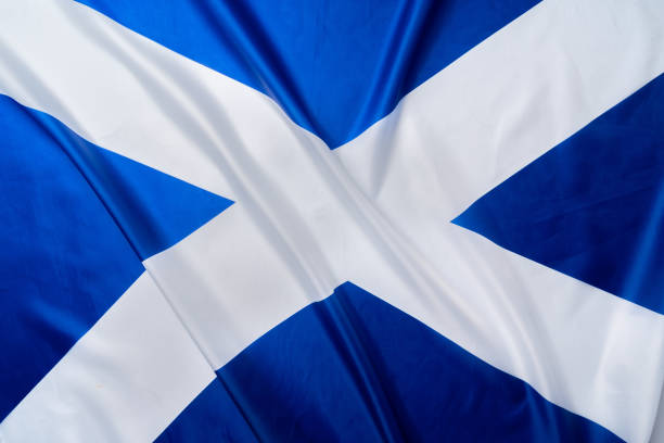 istock Rippled flag of Scotland lying on white surface 1283848636