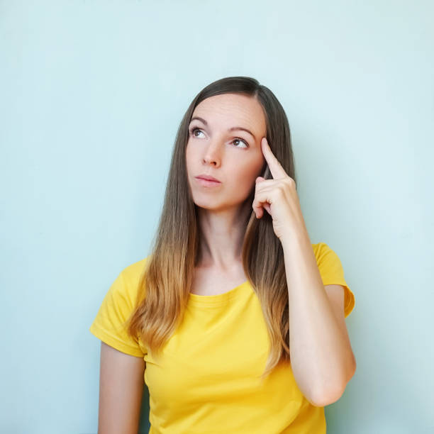 istock Portrait woman brunette on blue background. 1283849593