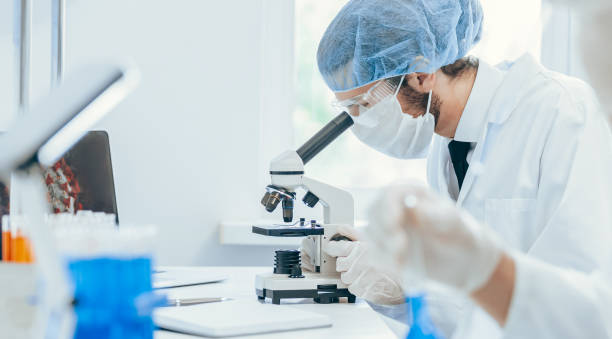 istock close up. a group of doctors and scientists work in the laboratory 1283849660