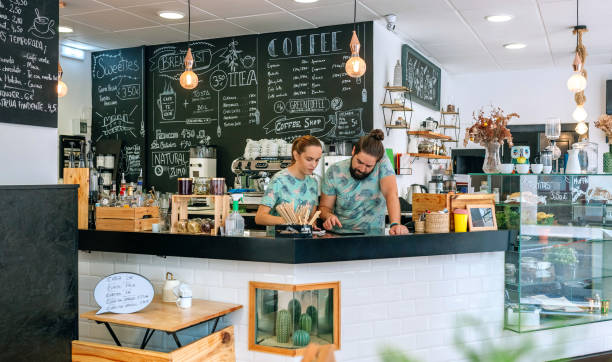 istock Owners of a coffee shop working looking at the tablet 1283849869