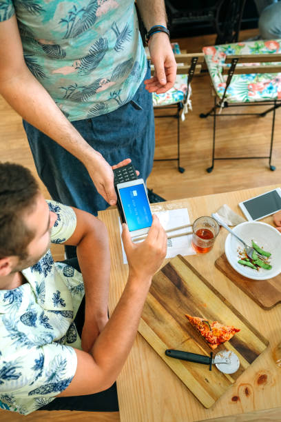 istock Customer paying the restaurant bill with a virtual mobile card 1283849873