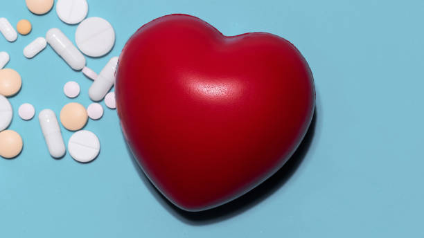 istock red heart, pills and dietary supplements on a blue background 1283850914