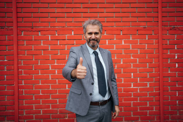 istock Content businessman showing thumbs up 1283851110