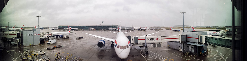 October 04, 2020 – Terminal 5, London Heathrow Airport, United Kingdom. Passenger aircraft parked up at stands around Terminal 5, at London Heathrow Airport, UK.