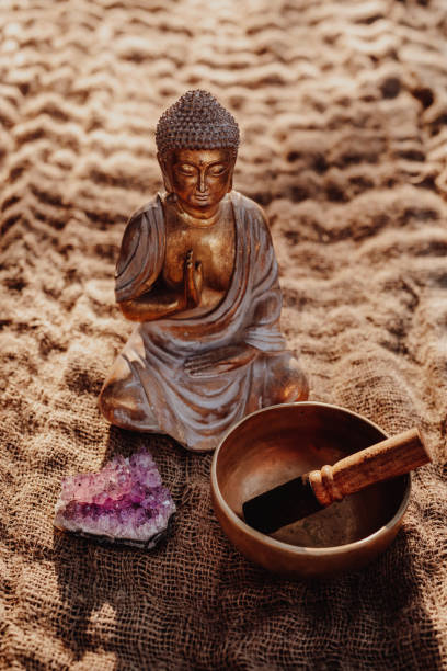 istock Buddha figurine with gong and amethyst 1283852154