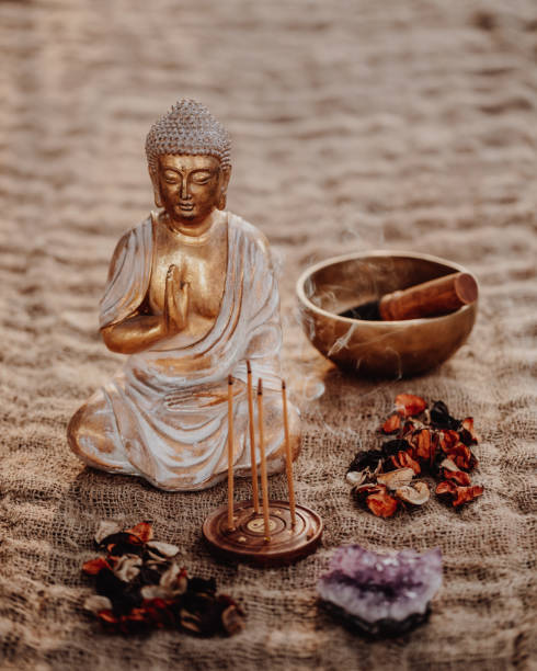 istock Buddha figurine with incense, gong, amethyst and dried leaves 1283852192