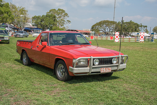 Darwin, NT, Australia-July 27,2018: Vintage car parade with red Ford Falcon at the Darwin Show Day in the NT