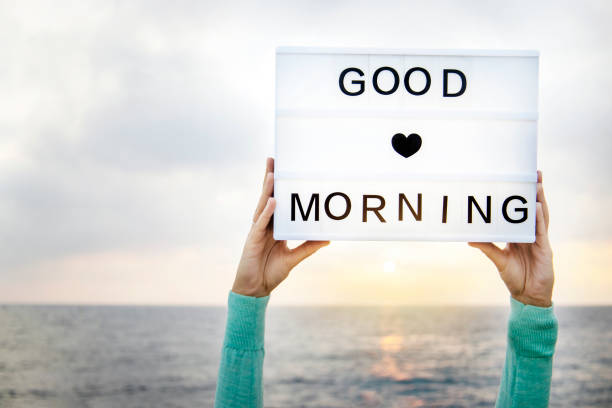 Good morning concept. Female hands holding a lightbox