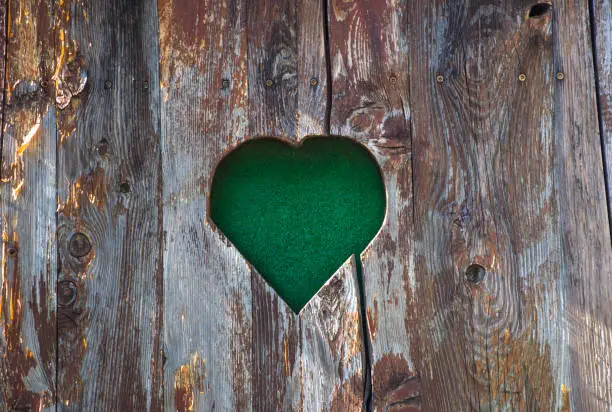 Old vintage heart-shaped wooden fence detail