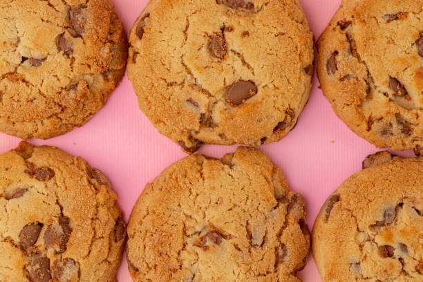 istock Chocolate chip cookies on pink background top view 1283853986