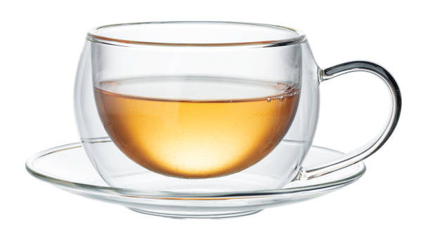 istock Glass cup of green tea isolated on white 1283854973