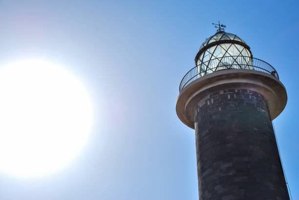 istock lighthouse at night, digital photo picture as a background 1283855632