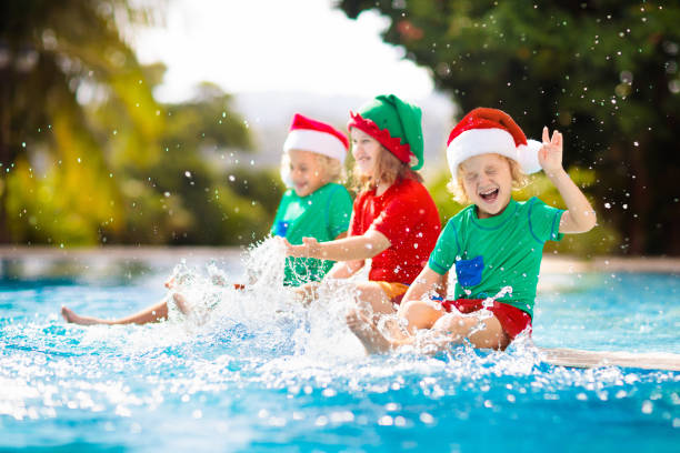istock Christmas vacation on tropical island. Xmas kids. 1283855865