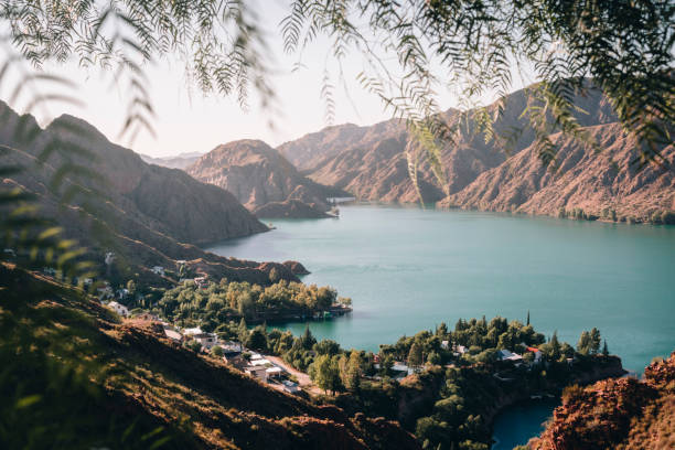 sunrise in water reservoir between mountains