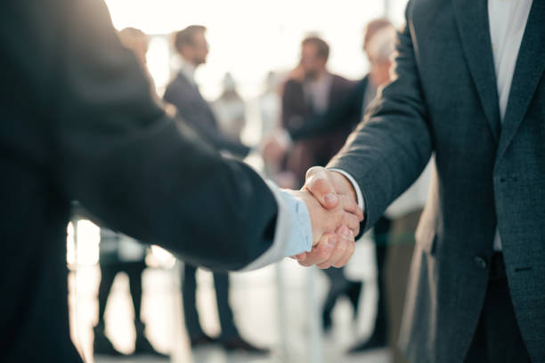 istock close up. business handshake on an office background 1283856817