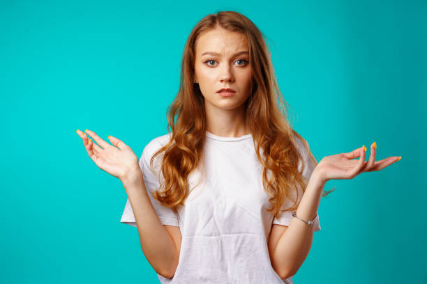 istock Young caucasian girl making do not know sign 1283859495