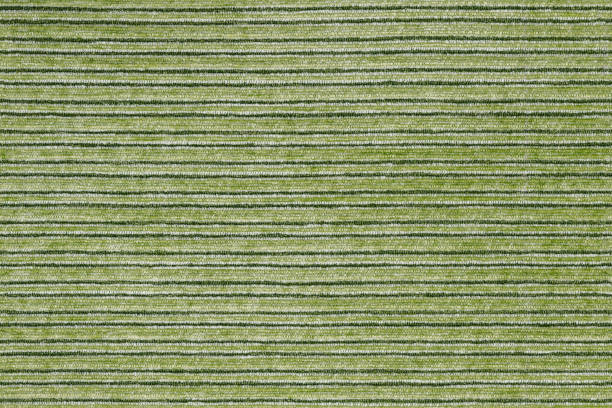 istock Seamless texture of horisontal stripped green polyester upholstery. 1283859602
