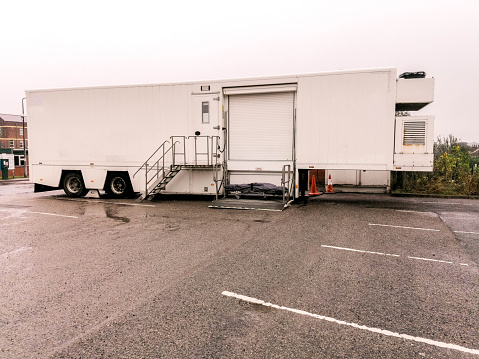 A large mobile scanning unit housed in the back of an articulated lorry trailer, used for health service patients.