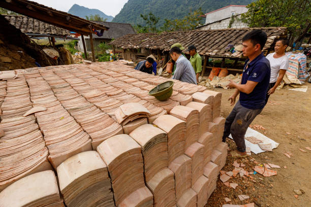 Tiles are handmade in Bac Son in Vietnam Bac Son, Long Son, Vietnam - November 22, 2019: Tiles are handmade in Bac Son in Vietnam adobe oven stock pictures, royalty-free photos & images