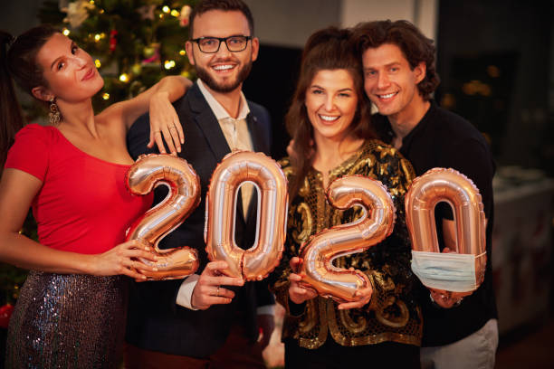 istock Two beautiful young couples having fun at New Year's Eve Party 1283862155