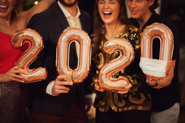istock Two beautiful young couples having fun at New Year's Eve Party 1283862181