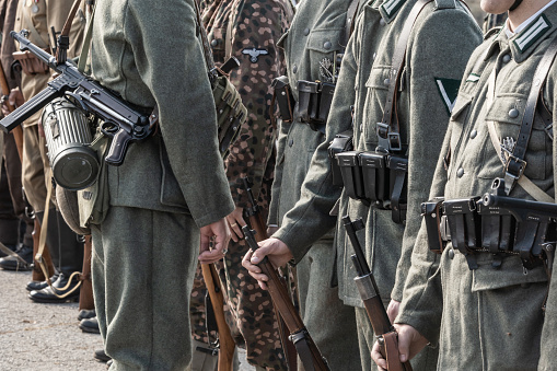 Veliko Tarnovo, Bulgaria - October 17, 2020:Actors depicting Nish operation. Re-enactors dressed as World War II Bulgarian soldiers walks on forest road.