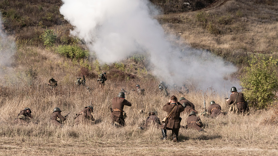 Veliko Tarnovo, Bulgaria - October 17, 2020:Actors depicting Nish operation. Re-enactors dressed as World War II Bulgarian soldiers walks on forest road.