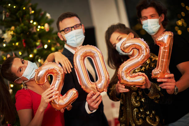istock Two beautiful young couples having fun at New Year's Eve Party 1283862301