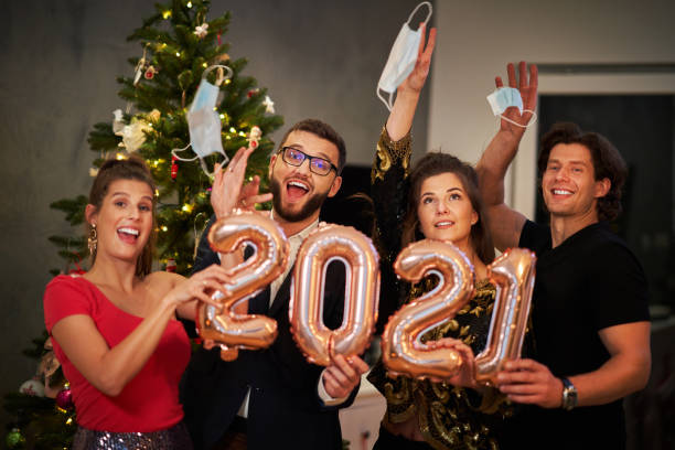istock Two beautiful young couples having fun at New Year's Eve Party 1283862362