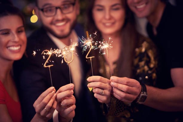 two beautiful young couples having fun at new year's eve party - number 33 fotos imagens e fotografias de stock