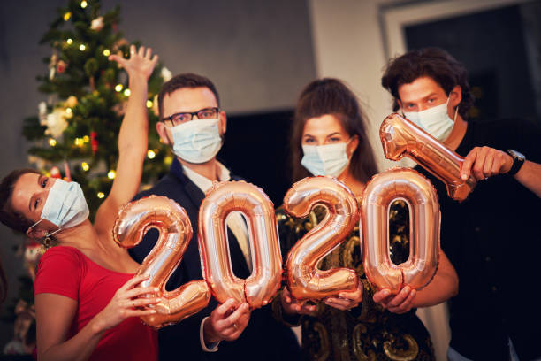 istock Two beautiful young couples having fun at New Year's Eve Party 1283862442