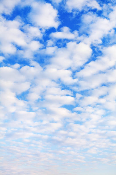 istock White cumulus clouds on blue sky background close up, fluffy cirrus cloud texture, beautiful cloudscape view, heaven on sunny summer day, cloudy weather, cloudiness backdrop, azure skies, ozone layer 1283863837