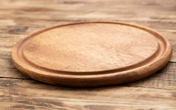 istock Top view on empty wooden round cutting board 1283865911