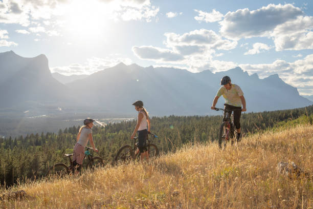 istock Mountain bikers ride along mountain ridge in the morning 1283868664