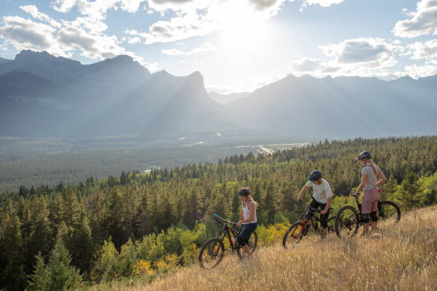 istock Mountain bikers relax on mountain ridge in the morning 1283868748
