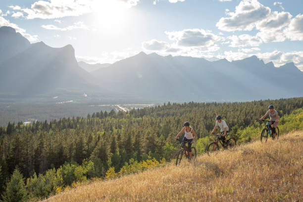 istock Mountain bikers relax on mountain ridge in the morning 1283869287