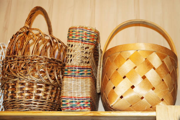 istock three wicker baskets on a wooden shelf 1283869506