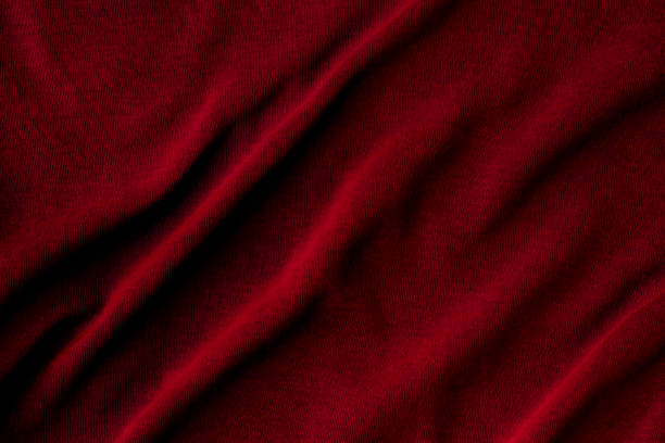 istock Jersey cotton fabric texture. Crumpled dark red textile background 1283869532