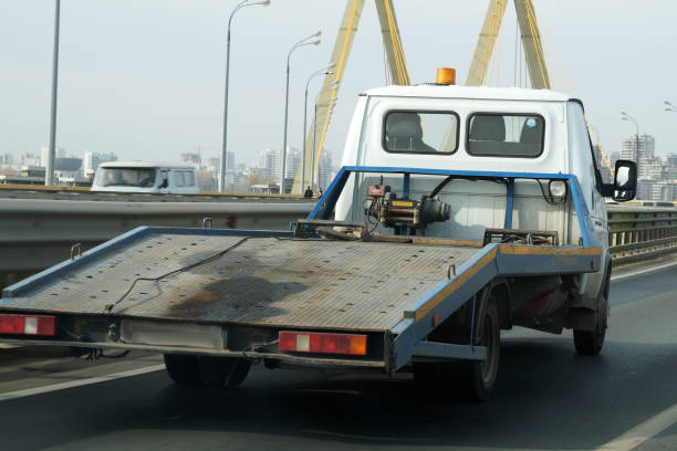 istock empty tow truck drives down the street, back view 1283869533