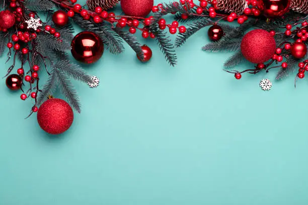 Photo of Christmas decorations on the blue background with copy space for your text.