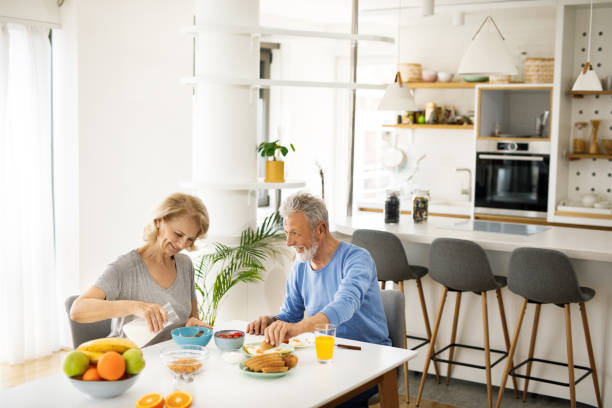 istock Senior couple having a breakfast together at home 1283869958