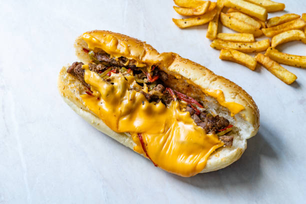 istock Philly Cheese Steak Sandwich with Melted Cheddar Cheese and Potatoes 1283870337